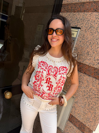Pantalón flare con detalle de tachuelas
